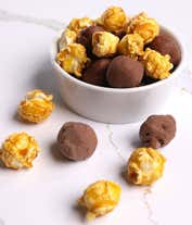 Alternative image 4 for A gift set overflowing with chocolate indulgences including chocolate-covered pretzels, mini cookies, caramel popcorn, chocolate and peanut butter buckeyes, six chocolate-covered Oreos, and a box of assorted truffles for a luxurious touch.