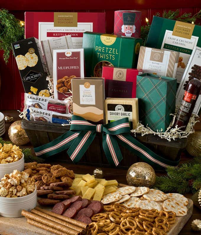  Gift basket includes gourmet popcorn, pretzel twists, key lime cookies, red velvet cookies, chocolate squares, caramel popcorn, peanut butter truffles, summer sausage, cheddar cheese, cubetti, dipped peanuts, flatbread crackers, mixed nuts, chocolate-cov