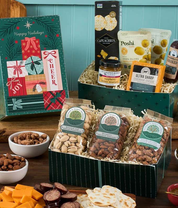 Holiday gift box filled with gourmet savory treats including cheddar cheese, smoked sausage, raspberry honey mustard, green olives, artisan crackers, and assorted nuts, displayed with festive packaging and holiday-themed presentation.