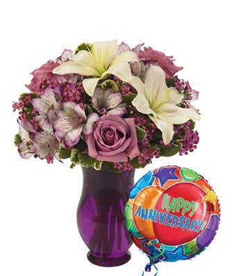 Purple roses and white lilies delivered with anniversary balloon