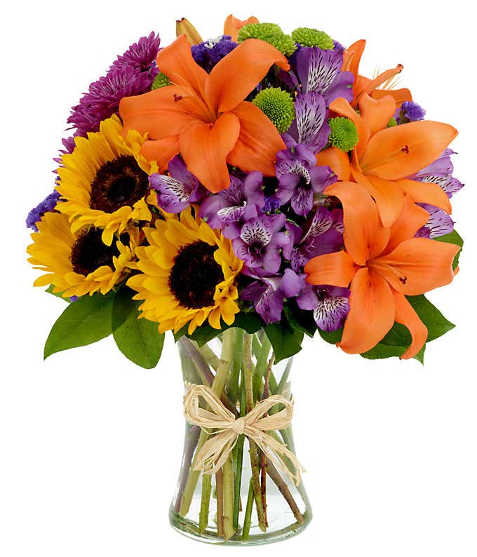 Mixed arrangement with sunflowers, orange lilies and purple flowers