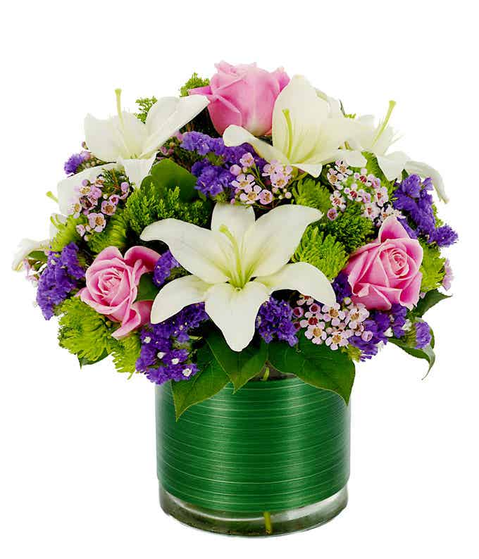 Round vase with white lilies and pink roses