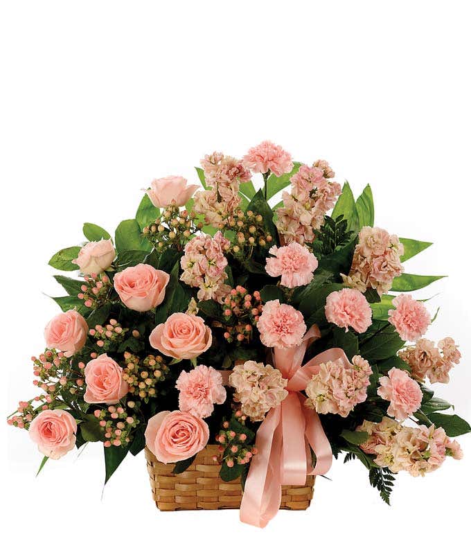 Sympathy floral basket with peach roses and hypericum