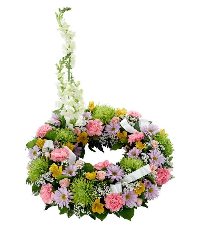 Funeral Wreath with pink carnations and purple flowers