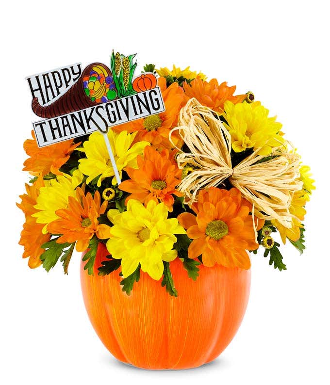 Pumpkin vase with Thanksgiving decoration and Fall flowers