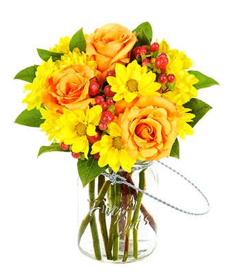 Orange roses, yellow daisies and red hypericum in a mason jar bouquet 