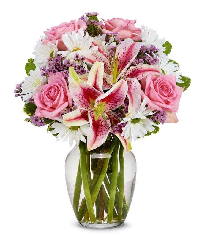 Pink roses, pink stargazer lilies and purple flowers