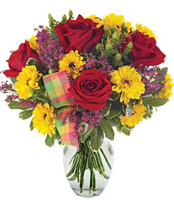 Red roses, yellow viking poms and heather in arrangement