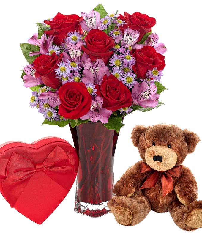 Teddy bear with flowers and chocolates