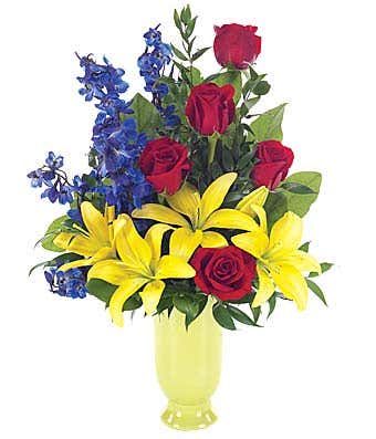 Red roses, yellow lilies and blue delphinium
