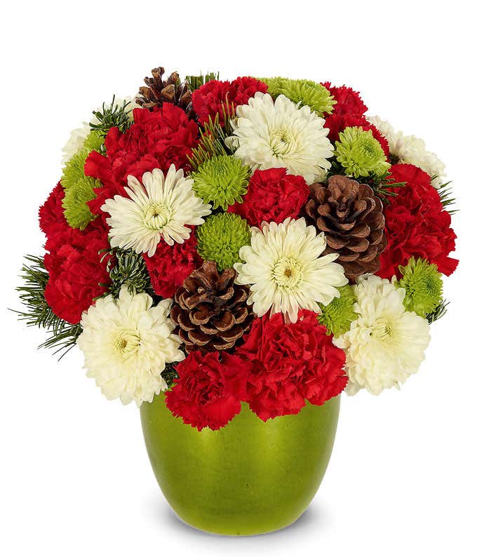 Red, white and green flowers in a green vase