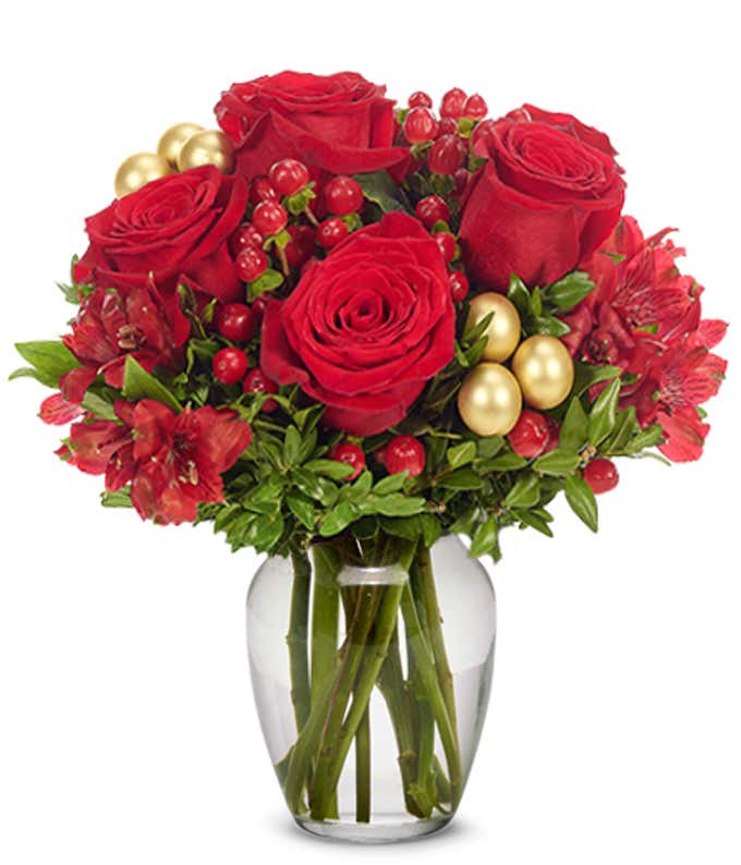 Red roses, red alstroemeria and hypericum in a rectangle vase