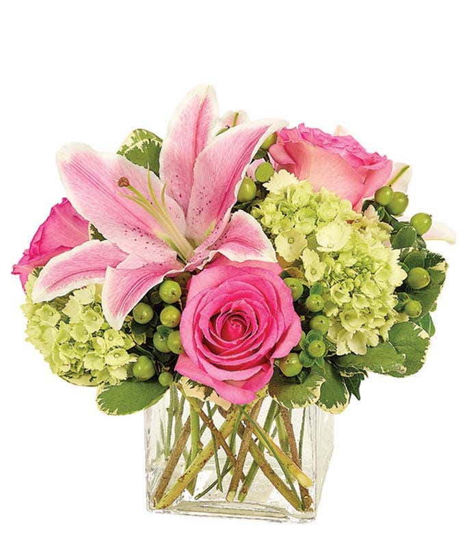 Pink lilies and pink roses with green hydrangea