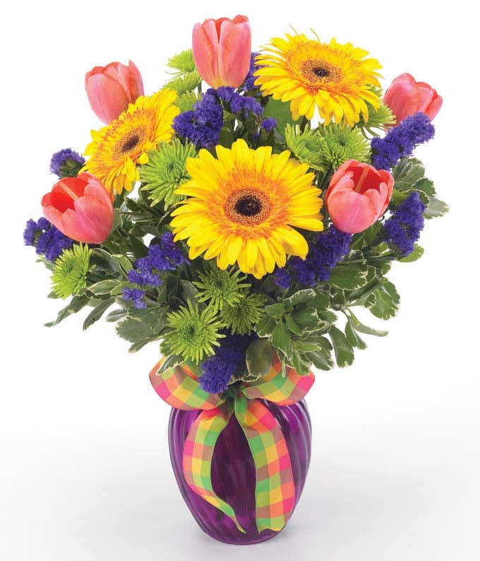 Flower Delivery in bright colors in purple vase