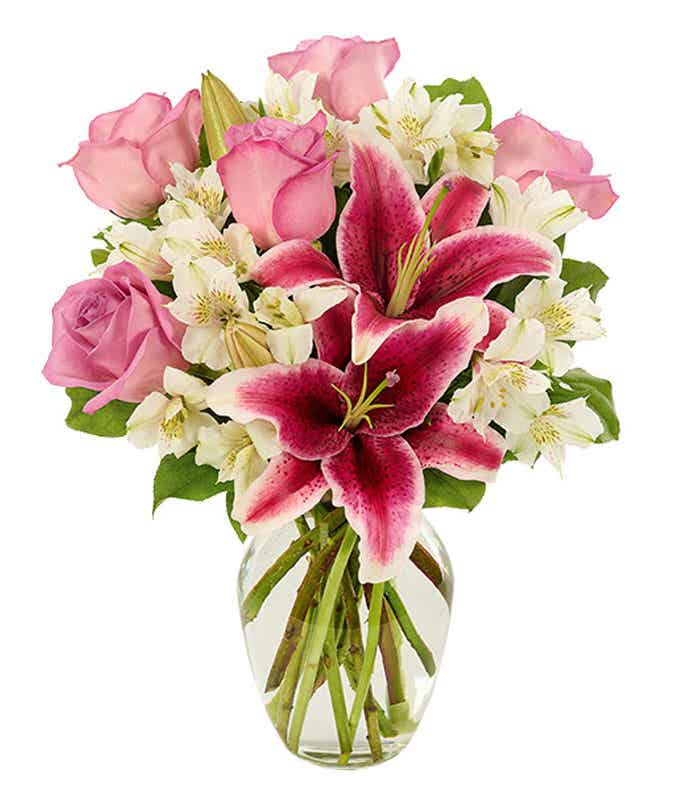 Pink stargazer lilies in cylinder vase