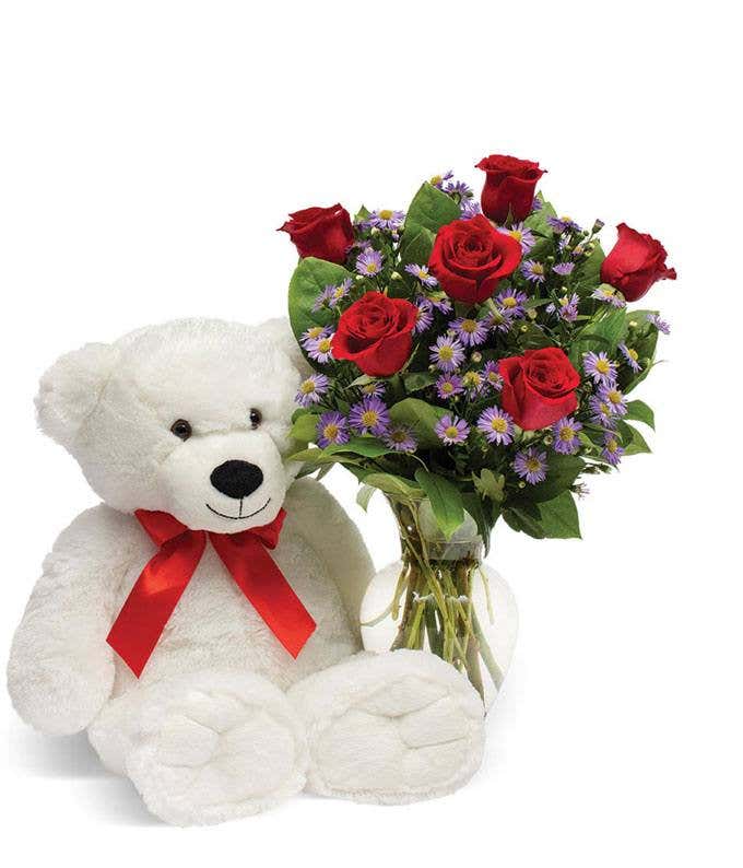 White teddy bear with red roses and purple monte casino