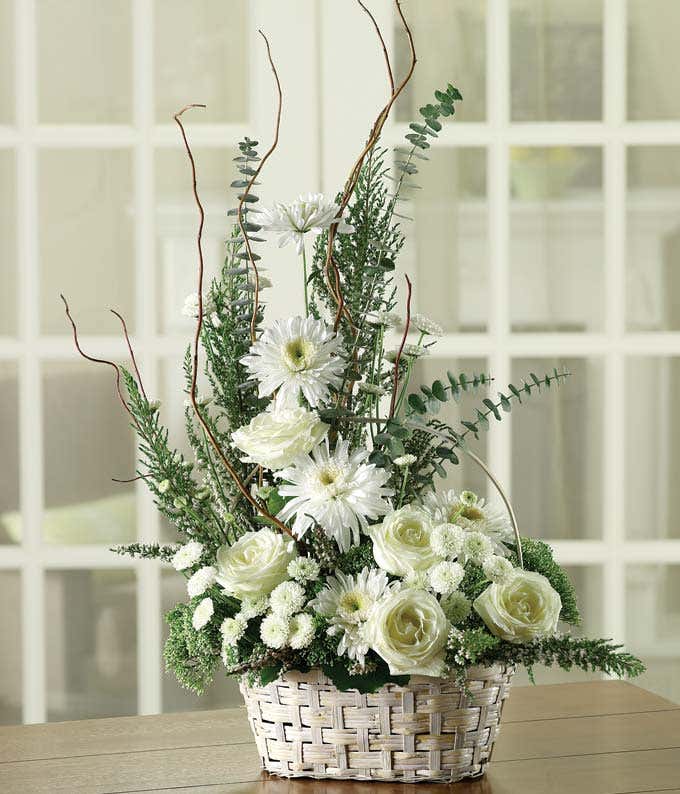 Sympathy floral basket with white roses, mums and greenery