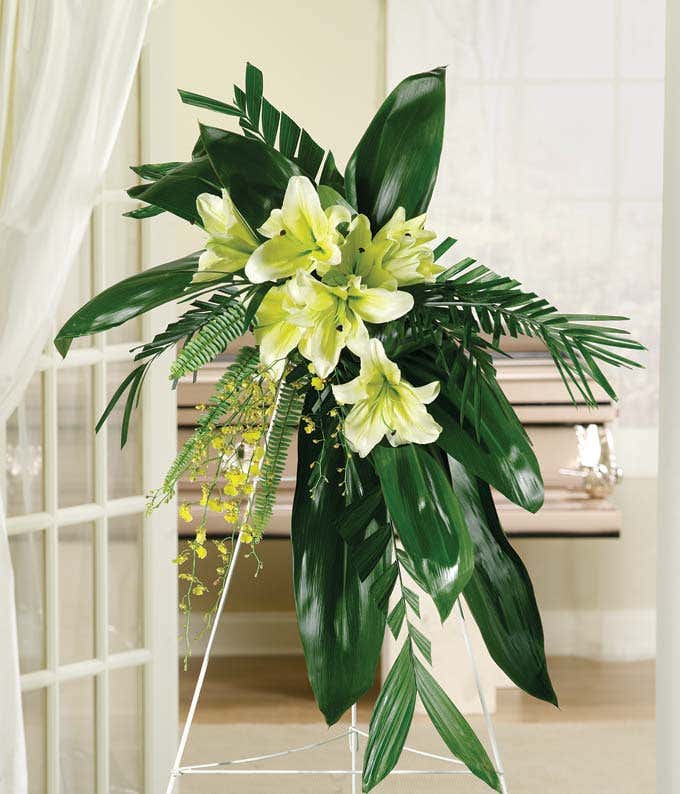 Yellow lily and yellow orchid standing spray