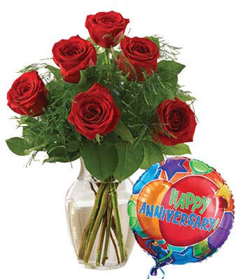 half dozen red roses with a happy anniversary balloon