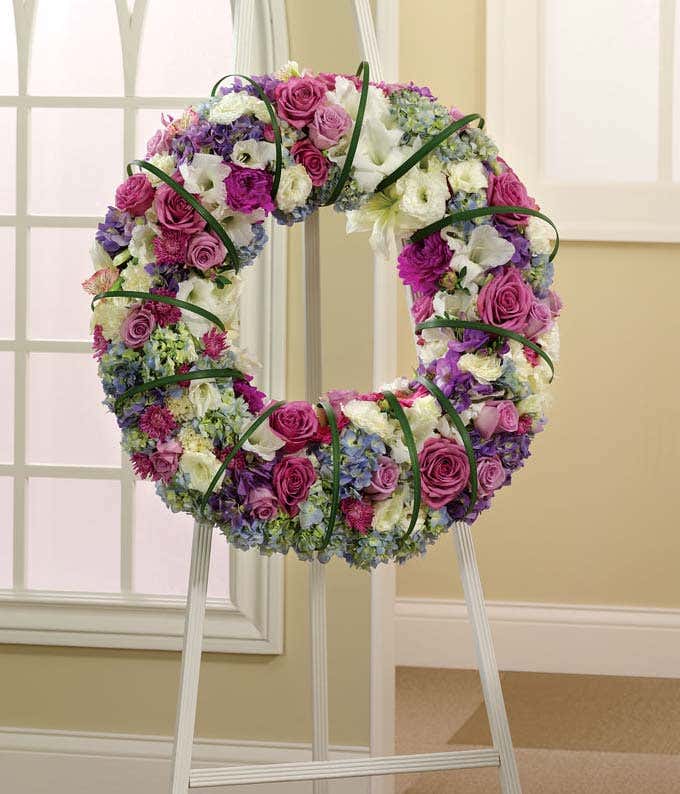 Pink, purple, white and blue standing wreath of roses