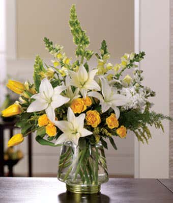 White lilies, yellow tulips and yellow rose florist delivered flowers