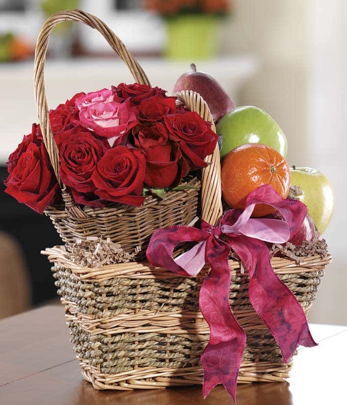 Fresh fruit delivered with red roses in basket
