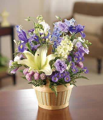 Baby boy bouquet with blue delphinium and purple flowers