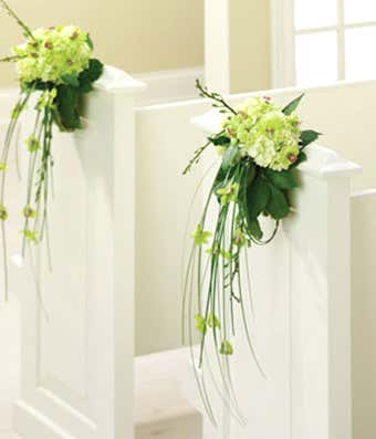 Wedding pew flowers with orchids and hydrangea