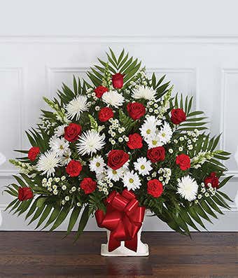 Red roses and white flower sympathy floor basket
