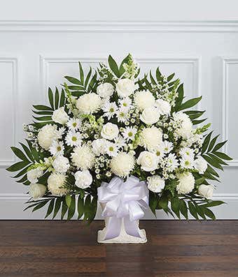 White sympathy basket with white roses and spider mums