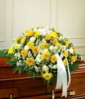 Half casket flower cover with Yellow roses and daises with white carnations