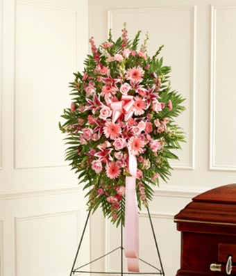 Pink sympathy standing spray with roses and stargazer lilies