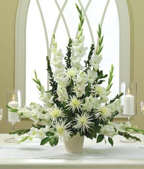 White flowers alter arrangement with mums and gladioli