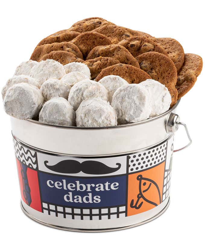 A Celebrate Dads bucket filled with David's cookies. The bucket features a colorful design with a mustache and a fishing rod. The assortment includes chocolate chip cookies and powdered sugar cookies.
