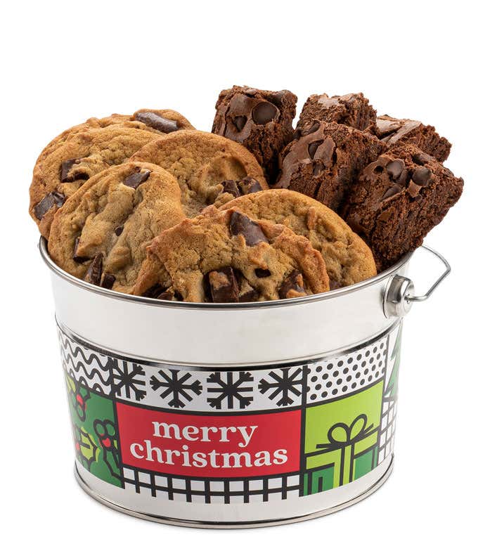 Festive 'Merry Christmas' tin bucket filled with six chocolate chunk cookies and six chocolate chip brownies. The tin is decorated with holiday-themed designs, making it an ideal Christmas gift.