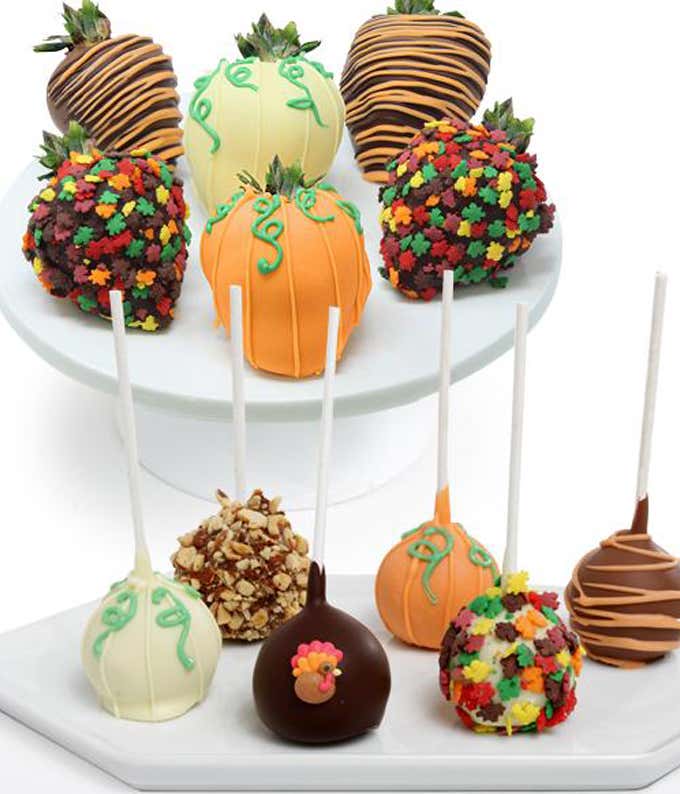 An assortment of 6 Belgian chocolate-covered strawberries and 6 Belgian chocolate-covered cake pops, adorned with Thanksgiving-themed edible decorations, fall-themed sprinkles, and dark, white, and milk chocolate, all beautifully arranged in an elegant gi