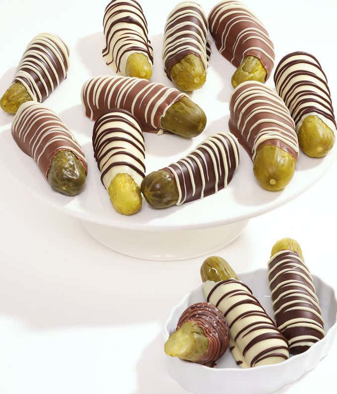 12 pickles covered in dark, milk, and white chocolate with white and dark chocolate drizzles