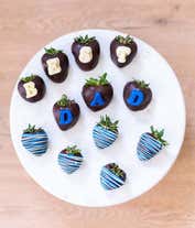 Alternative image 2 for A delightful Father's Day gift featuring one dozen fresh strawberries, dipped in Belgian chocolate and adorned with blue swizzle decorations. This indulgent treat offers a perfect blend of sweetness and elegance to celebrate Dad's special day.