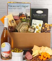 An abundent gift box filled with California Rosé Wine, assorted crackers, two cheeses, summer sausage, and snacks to make an amazing charcuterie spread. 