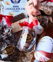 Alternative image 2 for A gift set featuring a bottle of California Sparkling Wine paired with chocolate-covered pretzels, mini cookies, caramel popcorn, chocolate peanut butter buckeyes, 6 chocolate-covered Oreos, a box of assorted chocolates, and I Love You card.