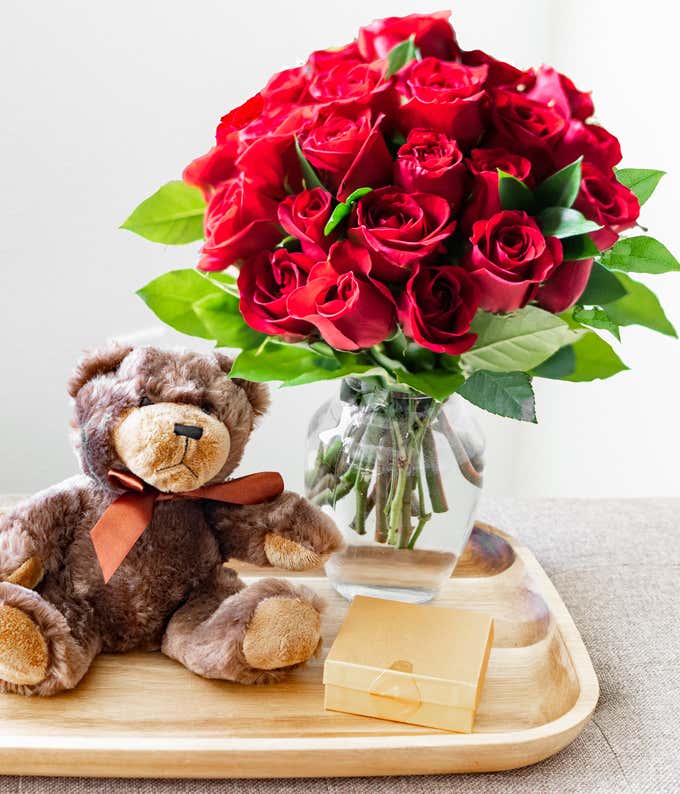 Two Dozen Red Roses with Chocolates & Teddy Bear in a Clear Glass Vase 