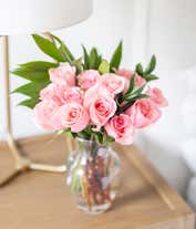 Alternative image 4 for A delicate arrangement featuring one dozen light pink roses. This elegant and timeless display offers a touch of romance and sophistication, perfect for any special occasion.