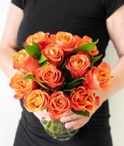 Alternative image 3 for One Dozen Orange Roses in a Clear Glass Vase