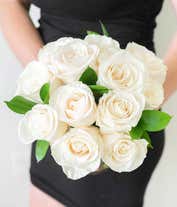 Alternative image 1 for An elegant arrangement featuring one dozen white roses. This classic and timeless display offers a touch of purity and sophistication, perfect for any special occasion.