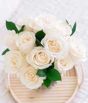 Alternative image 3 for An elegant arrangement featuring one dozen white roses. This classic and timeless display offers a touch of purity and sophistication, perfect for any special occasion.