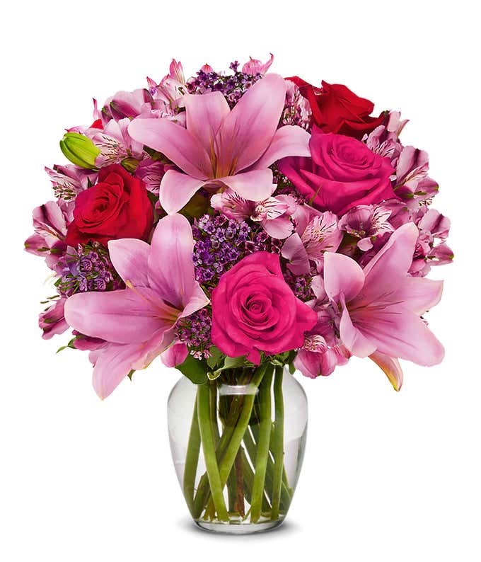 Pink asiatic lilies, pink roses and red roses