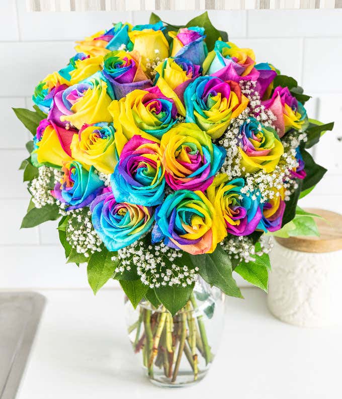 Two Dozen Rainbow Tie Dye Roses in a Clear Glass Vase