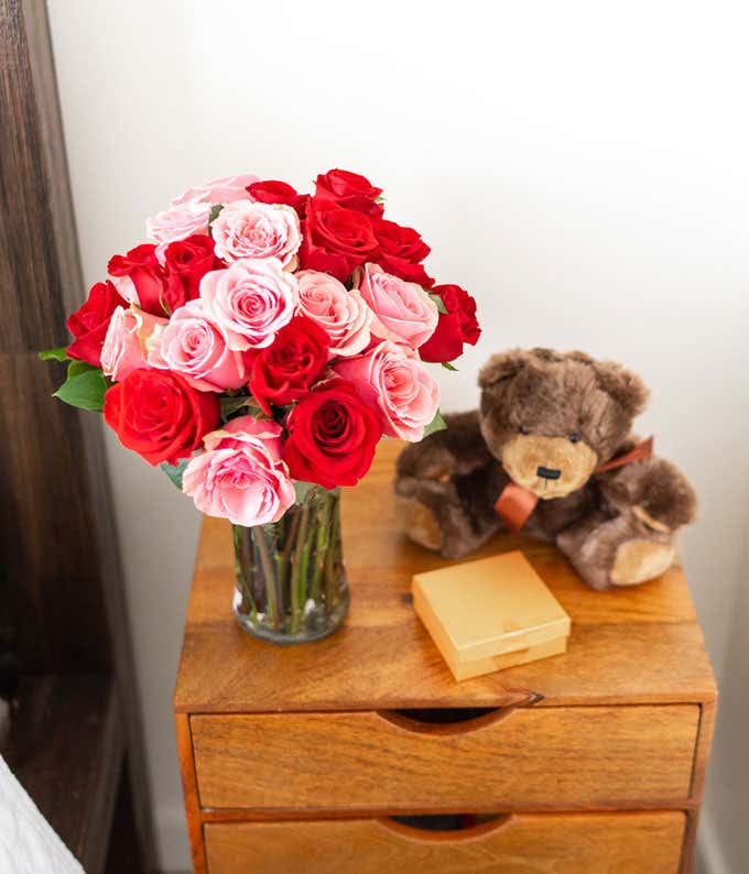Two Dozen Red & Pink Roses with a Clear Glass Vase, Chocolates, & Teddy Bear