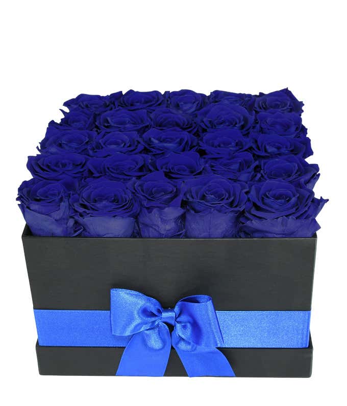 25 preserved dark blue roses arranged in a black hot box with a blue ribbon.