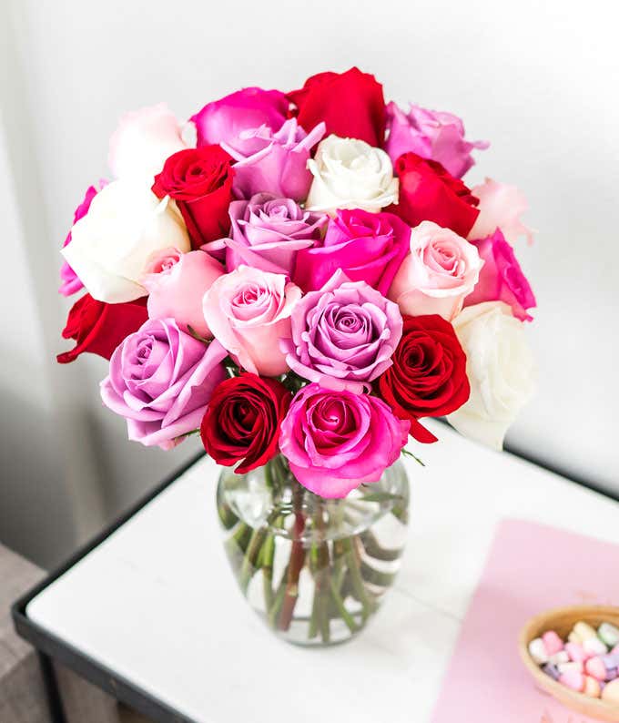 Two Dozen Red, Pink, Purple & White Roses with a Clear Glass Vase
